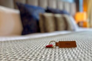 Room 2 – Room key resting on the double/twin bed at Grassmoor Bed and Breakfast in Keswick, Cumbria.