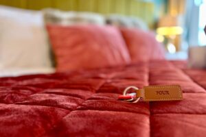Room 4 – Room key resting on the bed at Grassmoor Bed and Breakfast in Keswick.