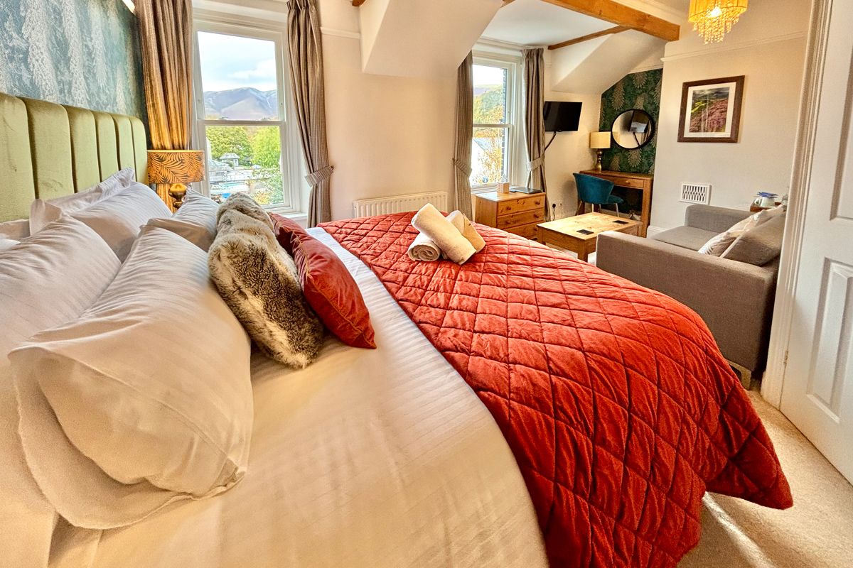 Room 4 – Bright double setup with soft furnishings and a generous layout.