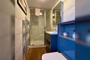 Room 4 – Modern ensuite with walk-in shower and contemporary fittings.