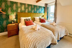 Room 4 – Bright twin arrangement showcasing the room’s airy design.